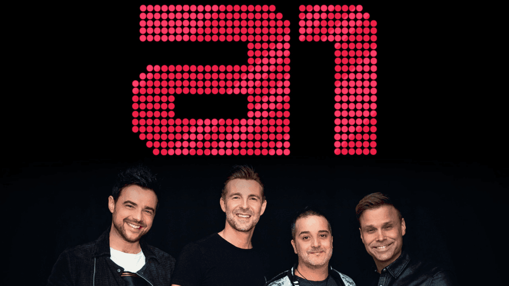British-norwegian boy band a1 smiling in front of their iconic red dot logo.