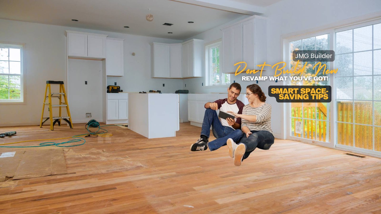 Budget-friendly home renovation tips. A young couple sitting on the floor of a partially renovated kitchen, reviewing renovation plans on a tablet. The space features newly installed hardwood floors, white cabinets, and construction tools, with text promoting "jmg builder" and "smart space-saving tips. "