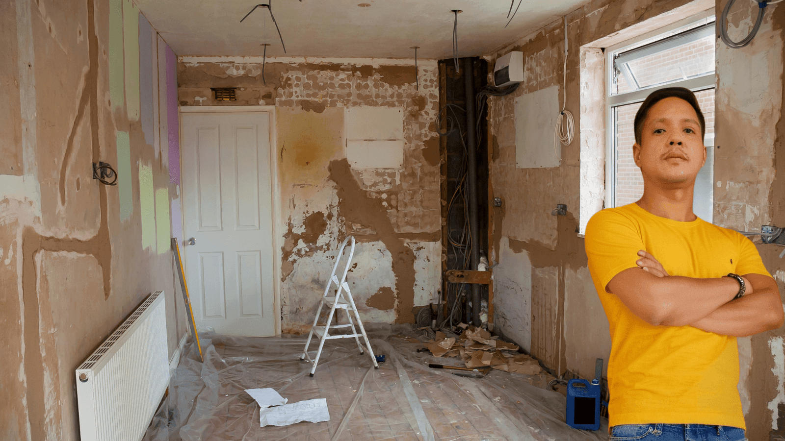 7 easy steps for house renovation in cagayan de oro 3 Engr. Jasper gementiza standing confidently in a partially renovated room with exposed walls, construction tools, and plastic sheeting on the floor, representing the initial stages of a house renovation project in cagayan de oro.