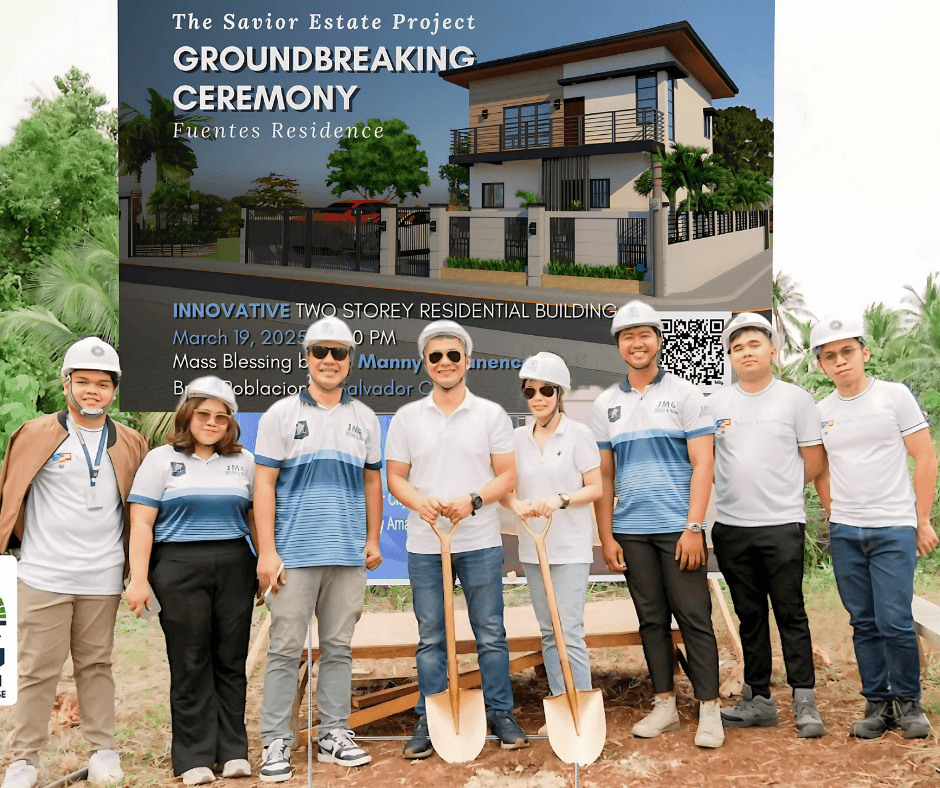 Jmg construction team during the fuentes residence groundbreaking ceremony in front of the project billboard for the innovative two-storey residential building.