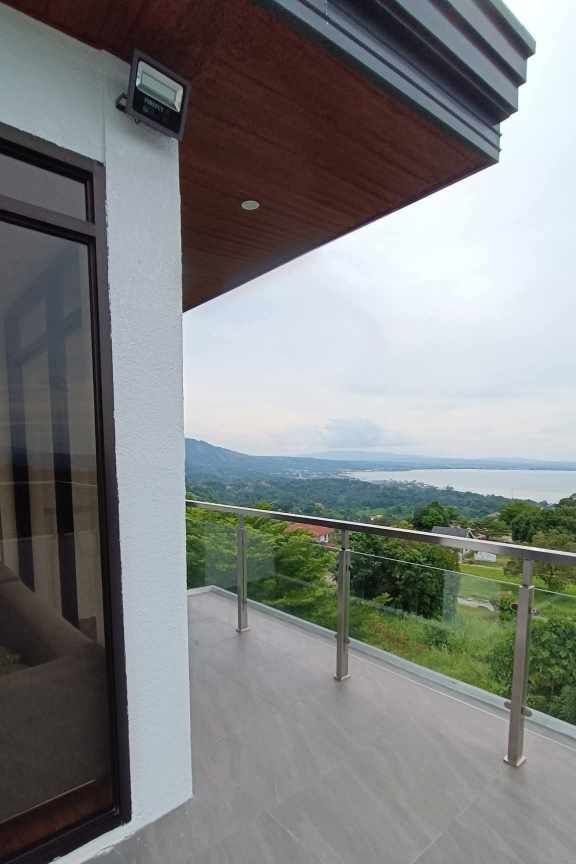 Teakwood hills luxury mansion – cagayan de oro 6 Corner balcony with stainless and glass railing and hillside view