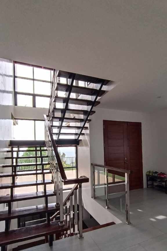 Teakwood hills luxury mansion – cagayan de oro 3 Custom steel and wood staircase inside a modern cdo home