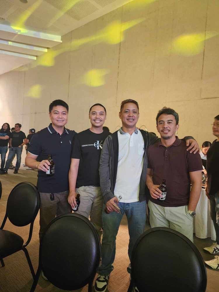 Teakwood hills luxury mansion – cagayan de oro 9 Four engineers at a formal gathering, smiling and standing in a ballroom