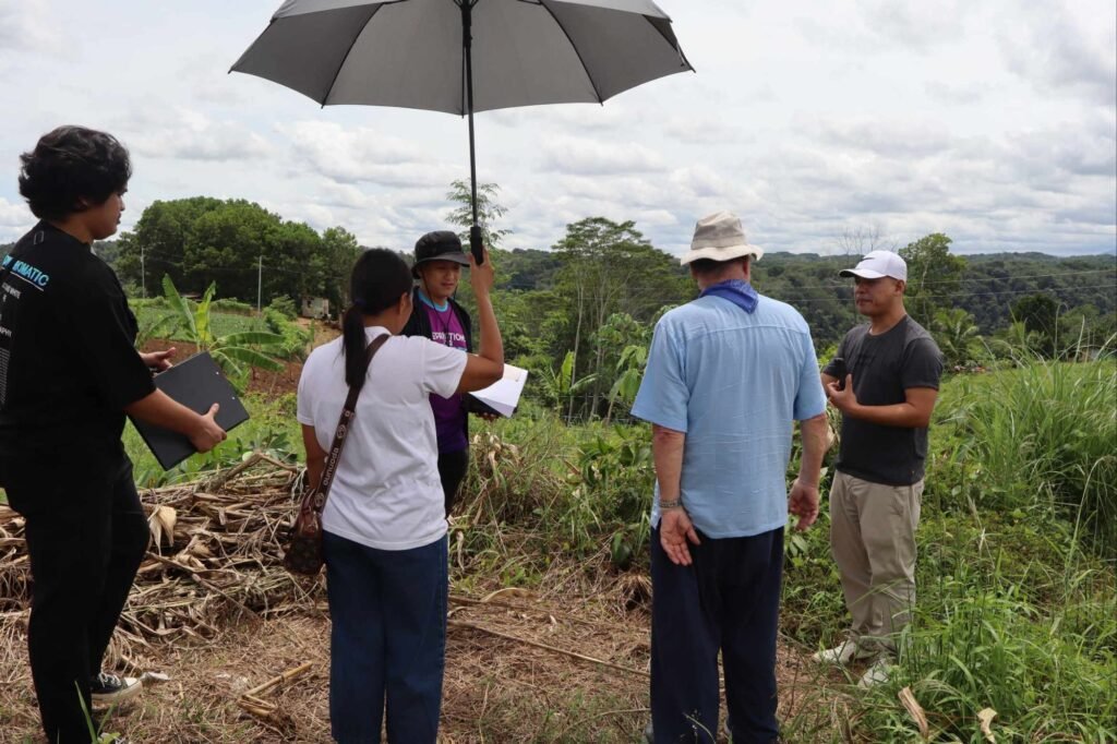 🚧 how contractors can spot toxic clients: a real case study from cagayan de oro 3 Spot toxic clients: contractors and spotted toxic client discussing project scope under umbrella outdoors.