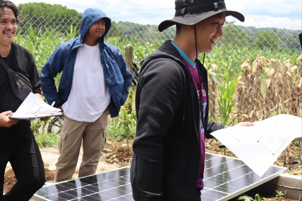 🚧 how contractors can spot toxic clients: a real case study from cagayan de oro 5 Team members observing the site beside a solar panel while client talks.