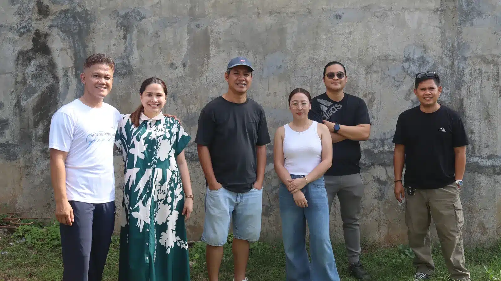 Property condition assessment & indicative value range: camella gran europa, lumbia, cagayan de oro 4 Group of six people standing in front of a weathered concrete wall during a property site visit in cagayan de oro